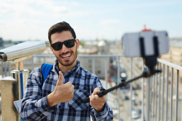 istock Happy Tourist Taking Smartphone Selfie 823902558