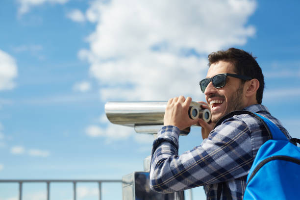 istock Cheerful Tourist on Rooftop Viewing Platform 823902606