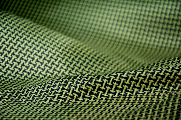 istock Black carbon fiber composite raw material close up background 823905798