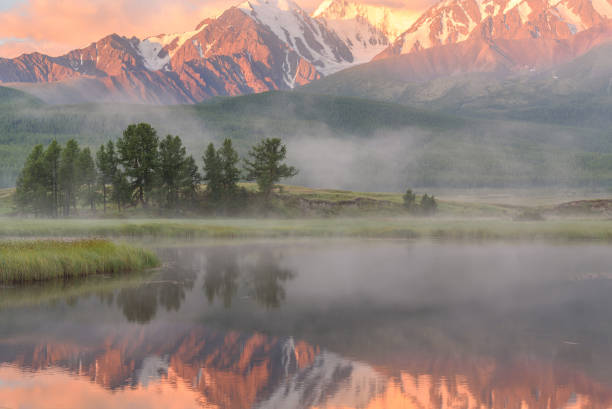 istock lake mountains fog reflection dawn 823905888