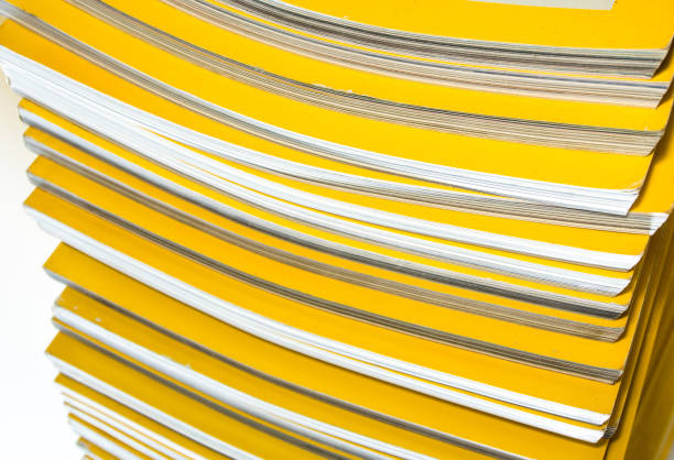 istock Stack of yellow monthly magazine 823908380