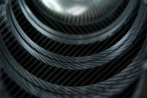 istock Black carbon fiber composite raw material close up background 823910468