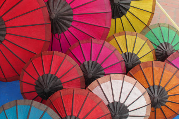 istock Many colorful opened paper umbrellas 823920596