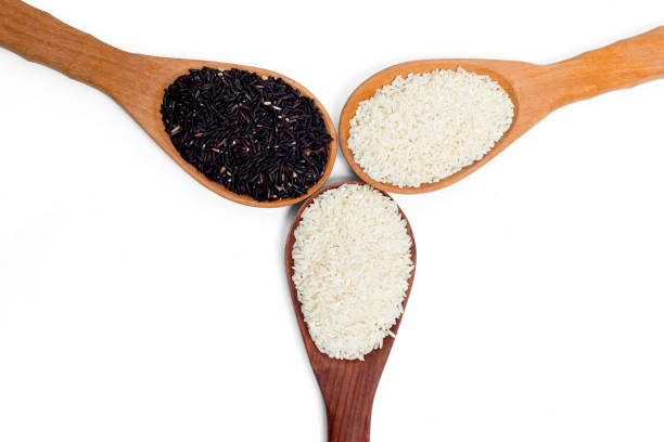istock grain,seed,rice in Wooden Spoon isolated on white background 823924992