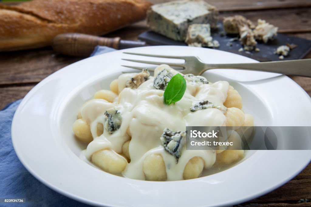 Italian pasta dish Homemade italian pasta with gorgonzola traditional cheese Gnocchi Stock Photo