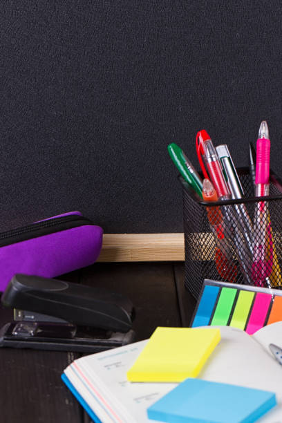 istock Pencil case with various stationery on old wooden table 823942236