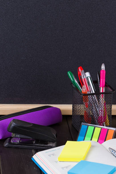 istock Pencil case with various stationery on old wooden table 823942378