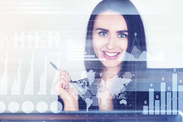 istock Smiling businesswoman, graphs and a world map 823942598