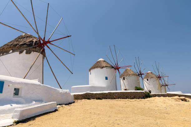istock Mykonos island windmills and blue sky 823950872