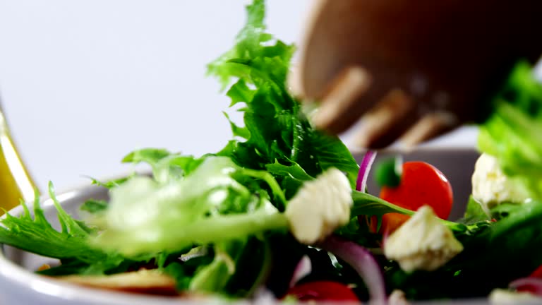 Close-up of mixing salad