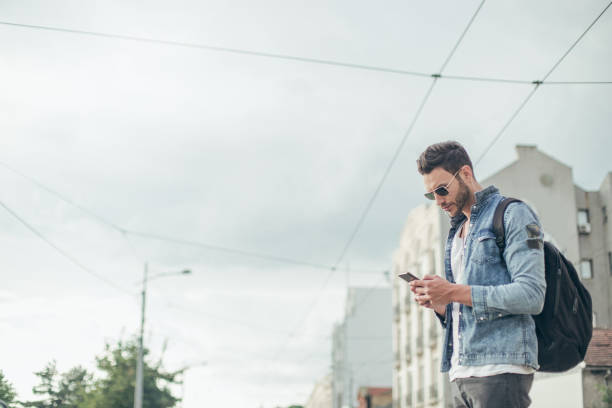 istock Hipster texting on the street 823956616