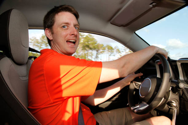 istock man drives car excitedly 823958764
