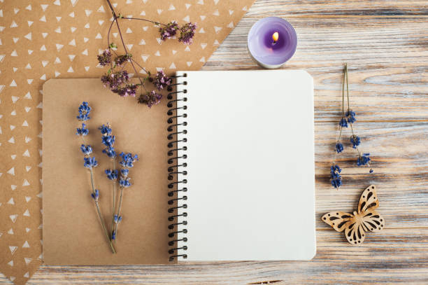 istock Notebook, lavender flowers, candles, butterfly 823959942