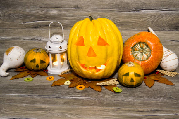 istock Halloween pumpkin head jack lantern on wooden background 823966522