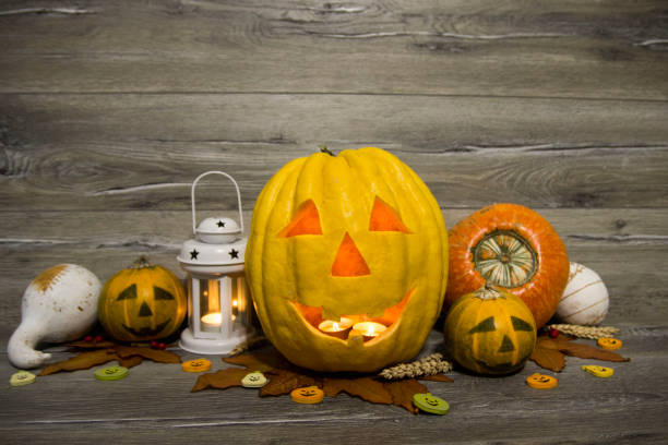istock Halloween pumpkin head jack lantern on wooden background 823966758