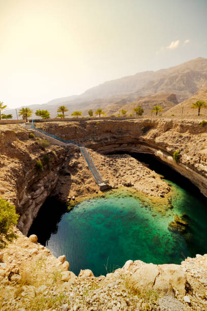 istock hawiyat najm sinkhole, oman 823975502