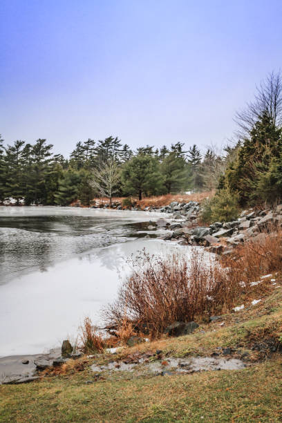 semi frozen lake in winter - long imagens e fotografias de stock