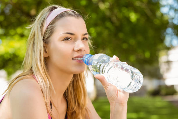 istock Fit blonde taking a break in the park 823977962