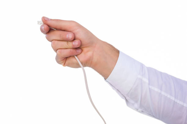 istock Close up of businessmans hand holding cable 823986110
