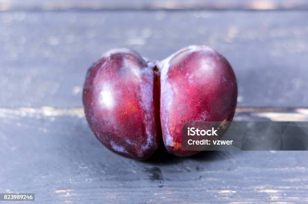 Unique And Not Ordinary Plum Plum In The Form Of An Ass Stock Photo - Download Image Now