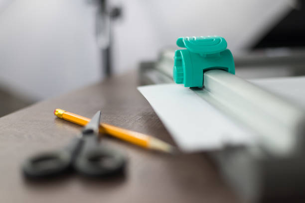 istock Roll paper knife on a workbench in a photo studio. 823993280