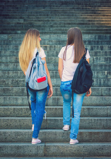 istock Two Student Girls Going to School 823996148