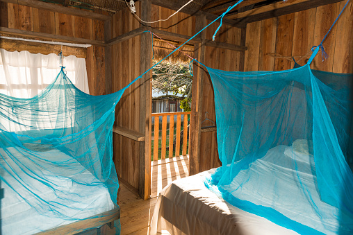 Part of simple room with two beds with moscito net. La Moskitia, Honduras