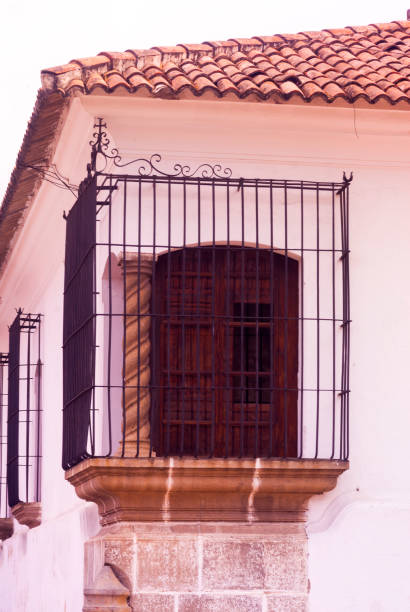 istock Corner perspective colonial house with barred windows in Antigua, Guatemala. 824016626