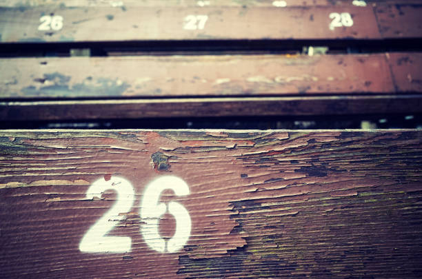 istock Number twenty six painted on an old wooden seat. 824017534