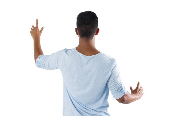 istock Man pretending to touch an invisible screen against white background 824017594