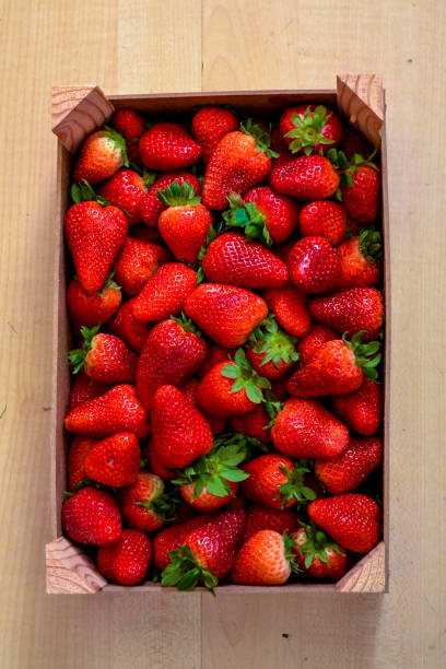 istock Strawberries in basket on wooden table 824024110