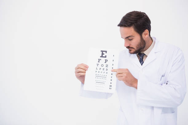 istock Doctor in lab coat showing eye test 824027554