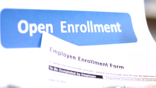 Open enrollment healthcare benefit forms.