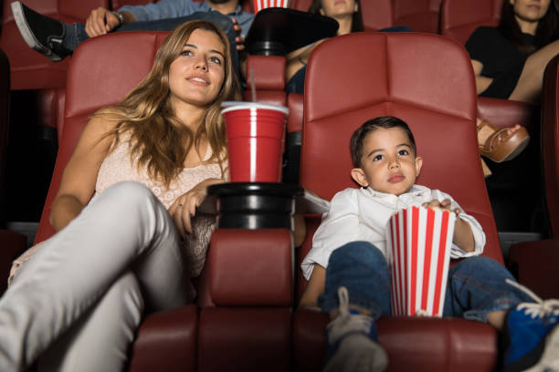 istock Mom and son on a movie date 824033066