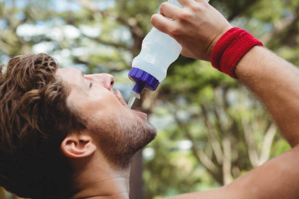 istock Close up of man drinking water 824033138