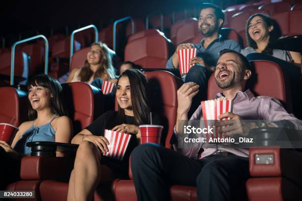 Group Of People Laughing At The Movie Theater Stock Photo - Download Image Now - Movie Theater, Movie, Film Industry