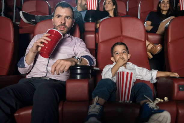 istock Father and son watching a movie 824033756