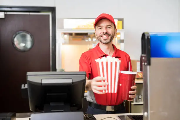 Photo of Man selling snacks at the movie theater