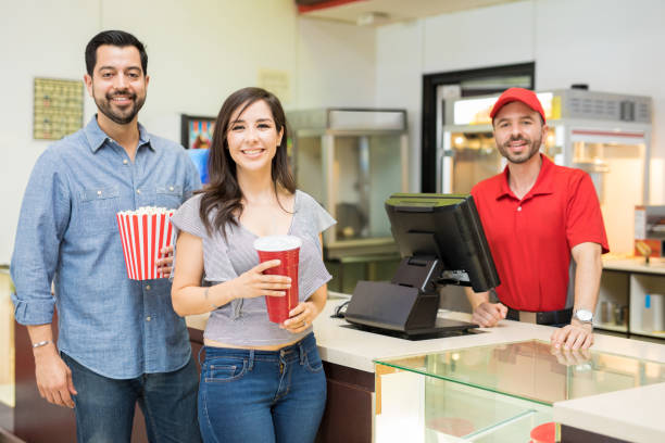 istock Happy couple in a concession stand 824036926