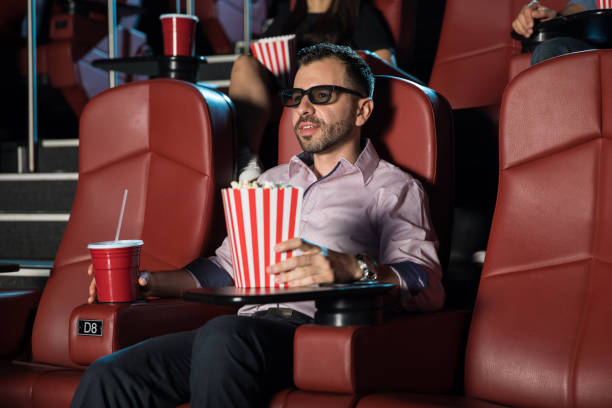 istock Guy watching a 3d movie by himself 824036974