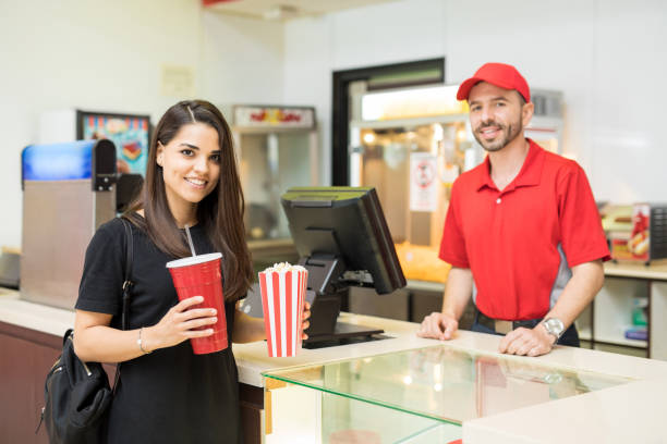istock Cute woman in a concession stand 824037174