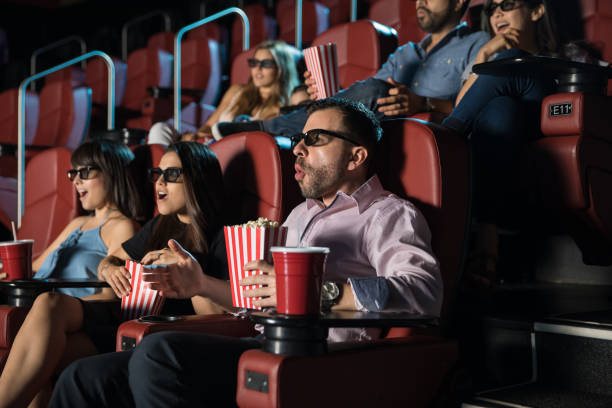 istock People watching a 3d movie 824037254