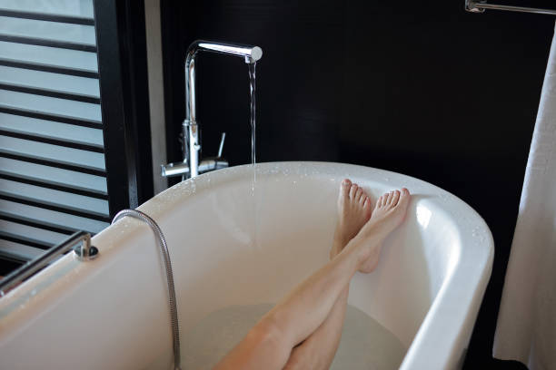 istock Woman taking a bath close up 824037260