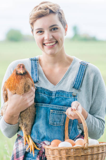 istock Woman With Chicken 824039840