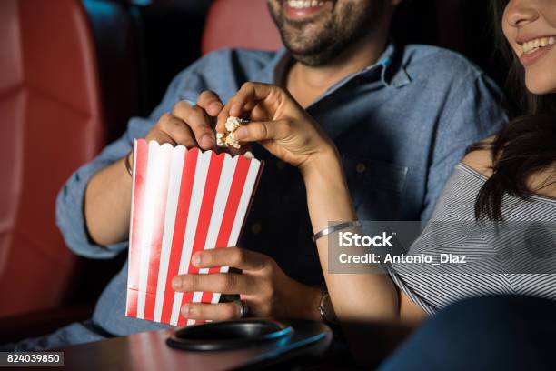 Eating Popcorn At The Movie Theater Stock Photo - Download Image Now - Movie Theater, Movie, Film Industry