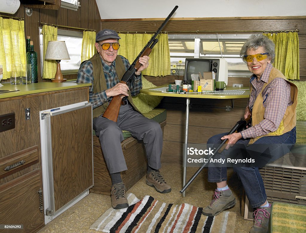 man and woman with guns  Gun Stock Photo