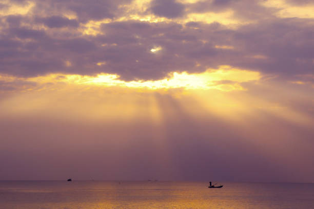 colorful sunset on Phu Quock island Vietnam sun ray go through the cloud