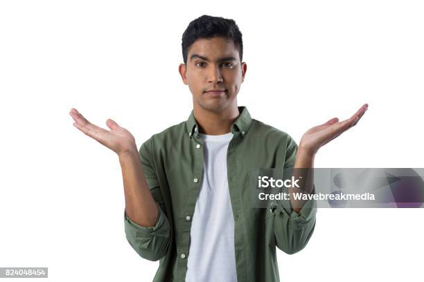 Frowning Man Gesturing Against White Background Stock Photo - Download Image Now - 80-89 Years, Adult, Adults Only