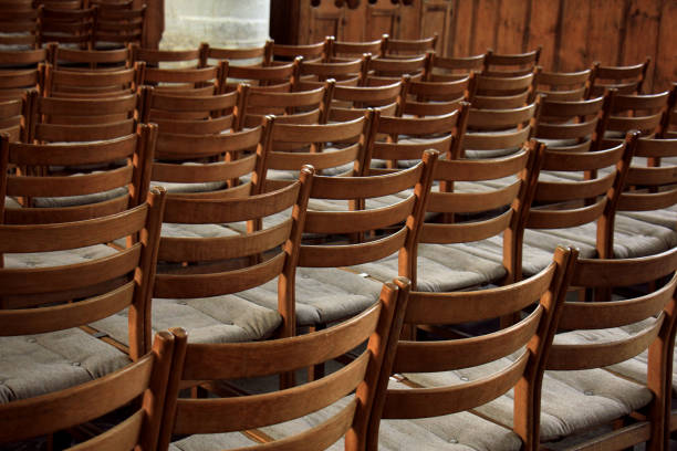 istock Wooden chairs in a church 824049094