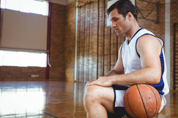 istock SIde view of thoughtful basketball player 824068416